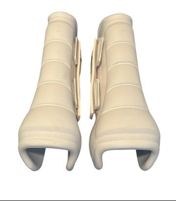 Pair of beige knee sleeves on a white background
