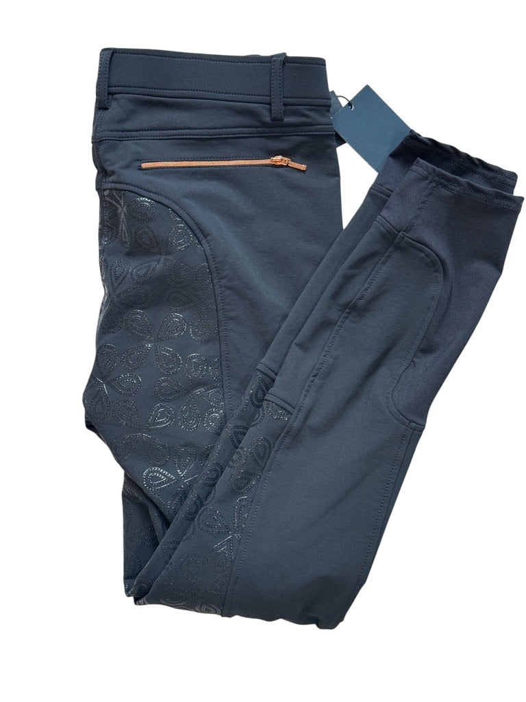 Folded dark blue pants with a belt on a white background