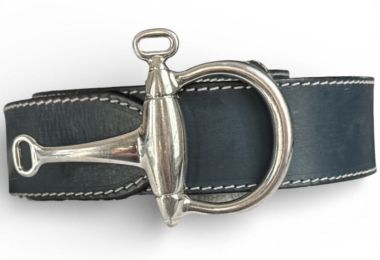 Black leather belt with silver metal buckle on a white background