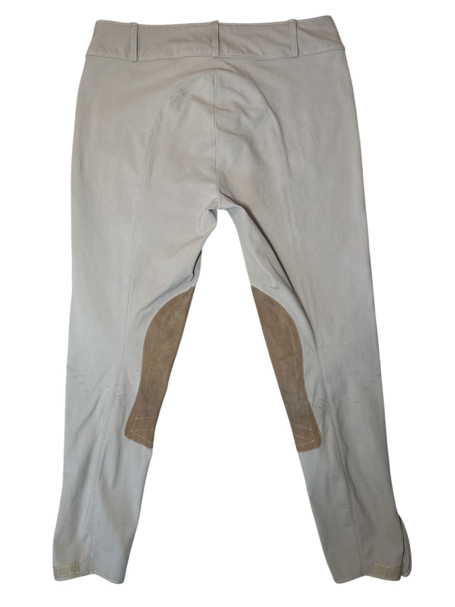 Beige equestrian pants with brown patches on a white background