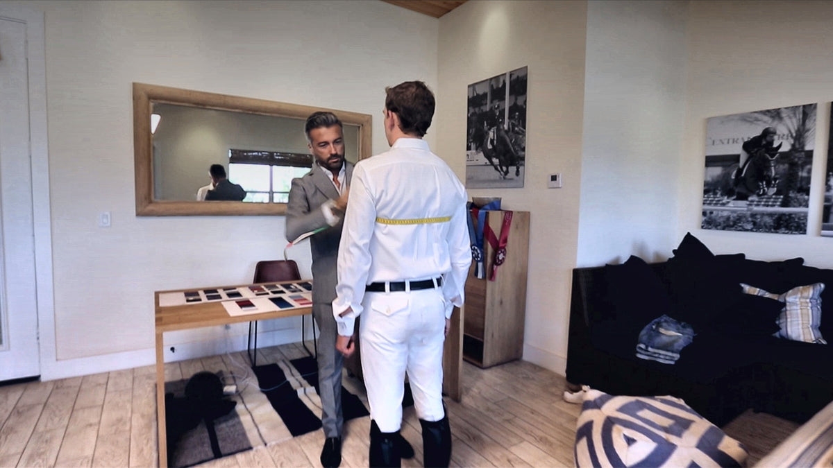Alessandro Albanese fitting a client in his showroom