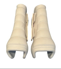 Pair of beige knee sleeves on a white background