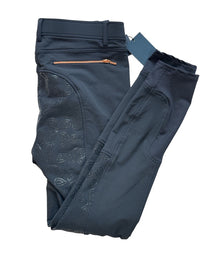 Folded dark blue pants with a belt on a white background