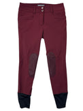Maroon riding pants with knee patches on a white background