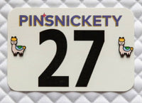 Card with 'PINSNICKETY' branding and number 27 on a textured gray background
