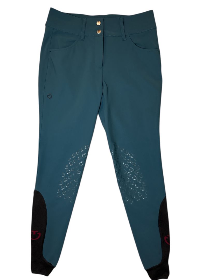 Teal riding pants with black accents on a white background