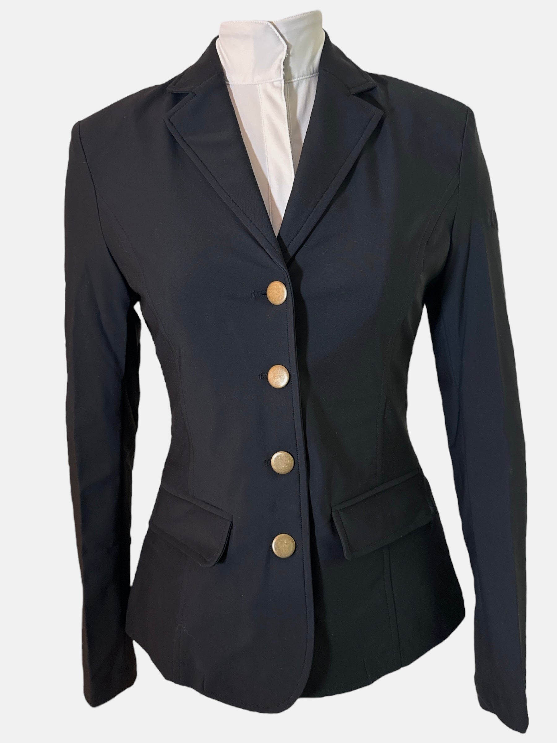 Black blazer with gold buttons on a mannequin against a white background