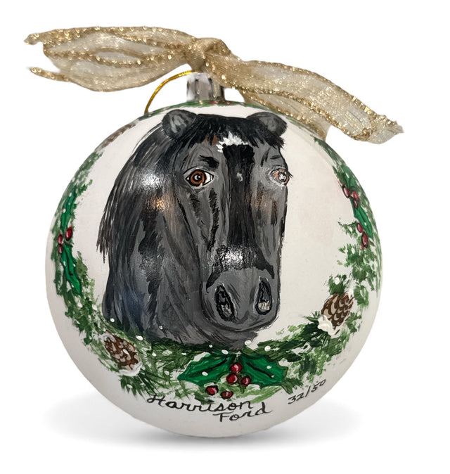 Christmas ornament with a horse design and decorative elements on a white background